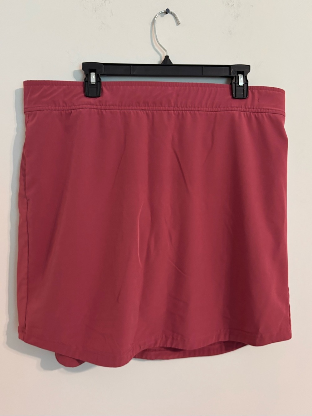 Eddie Bauer Women's Departure Performance Skort in a dark pink/crimson
